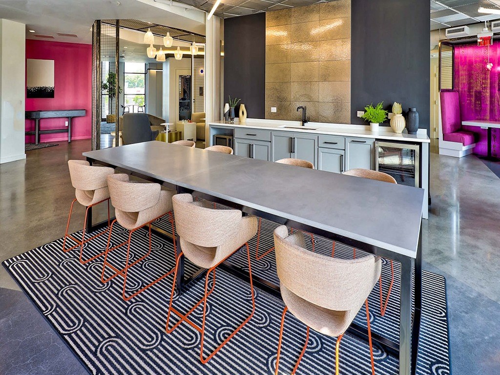 a conference room with a long table and chairs